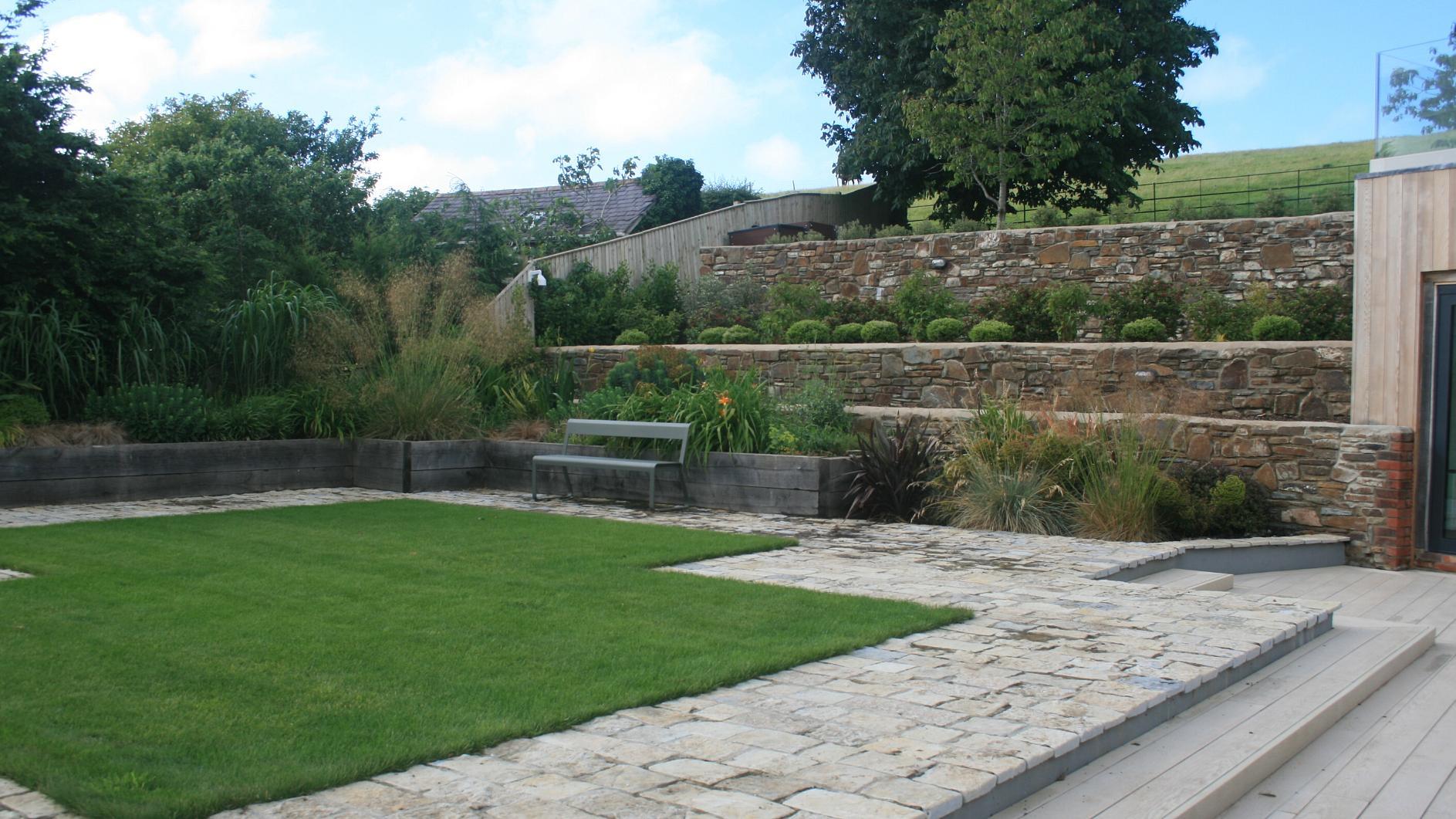 Alison Bockh Garden Design and Landscaping - North Devon - Lawn area over 5 car garage and raised beds