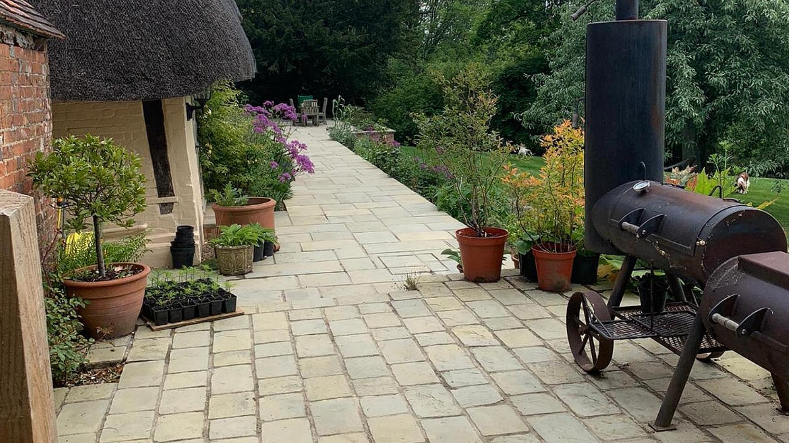 Alison Bockh Garden Design and Landscaping - North Devon -Much deeper patio with beds and potted plants