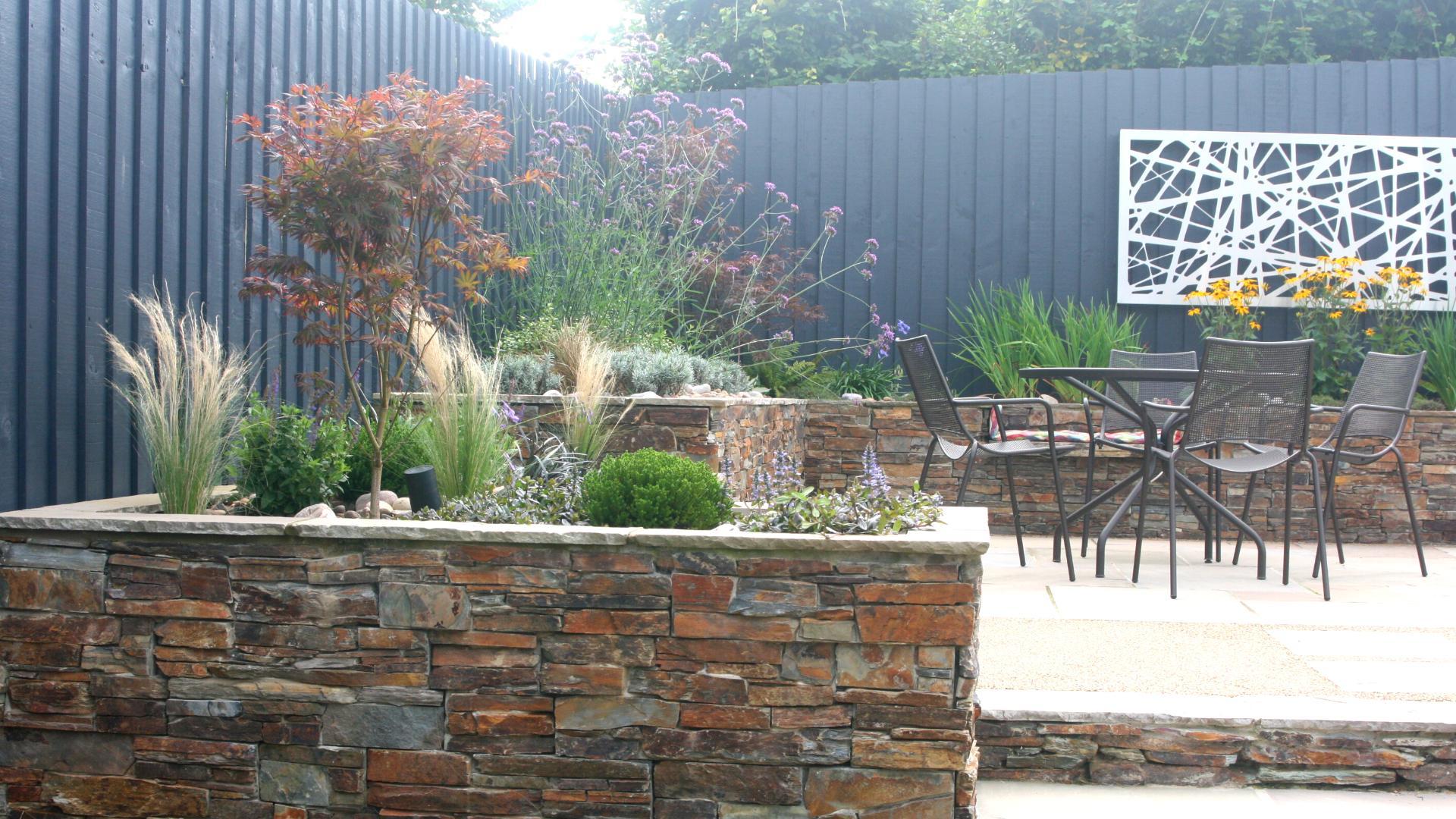 Alison Bockh Garden Design - Reused stone and painted fencing