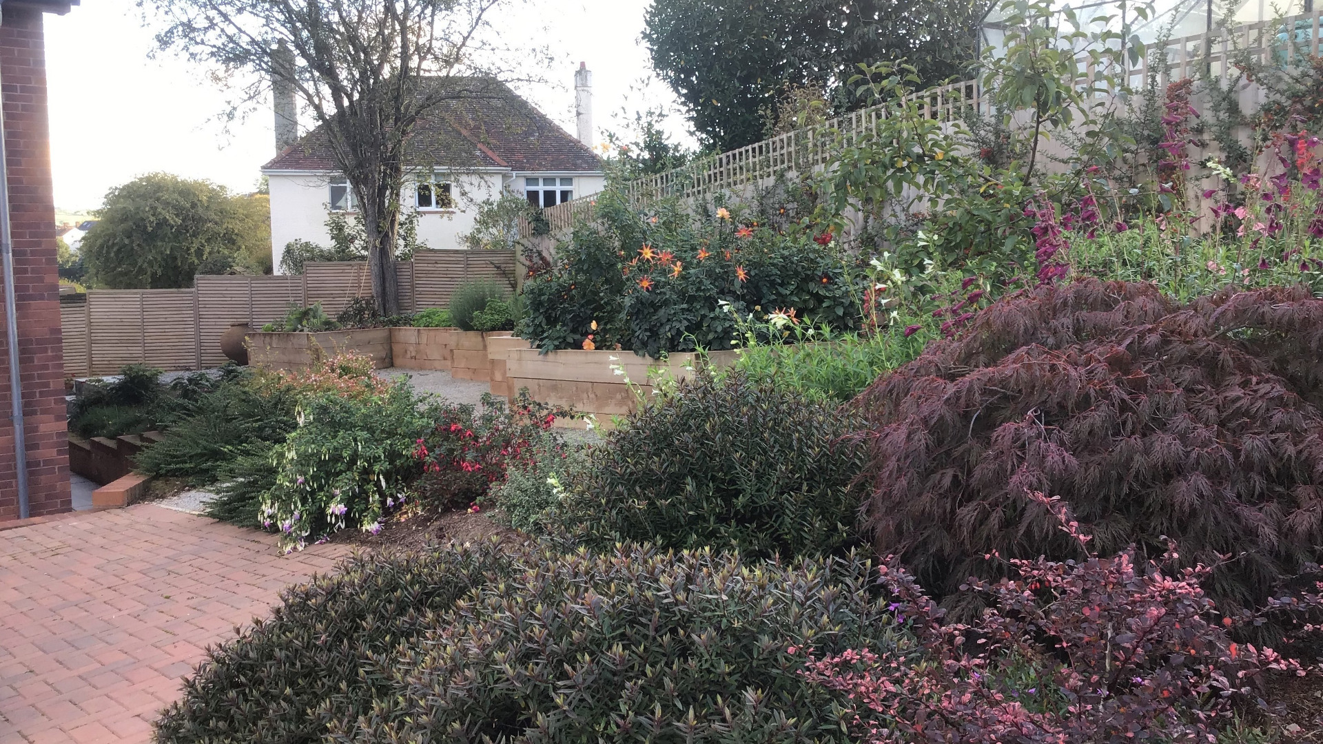 Alison Bockh Garden Design and Landscaping - North Devon - Side area after - hard landscaping and raised beds a